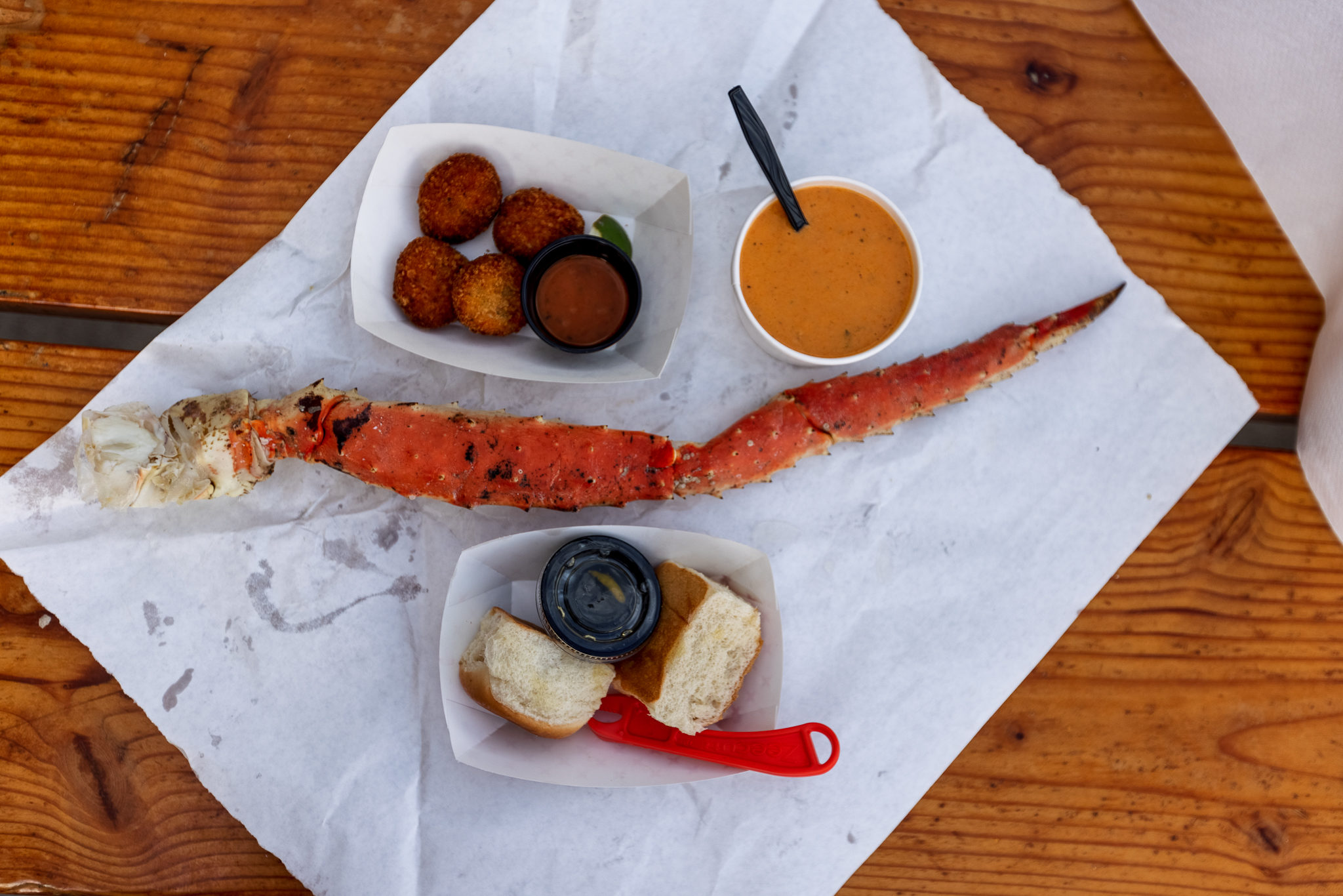 A king crab leg, crab bisque, rolls, and crab cakes from Tracy's King Crab Shack in Juneau