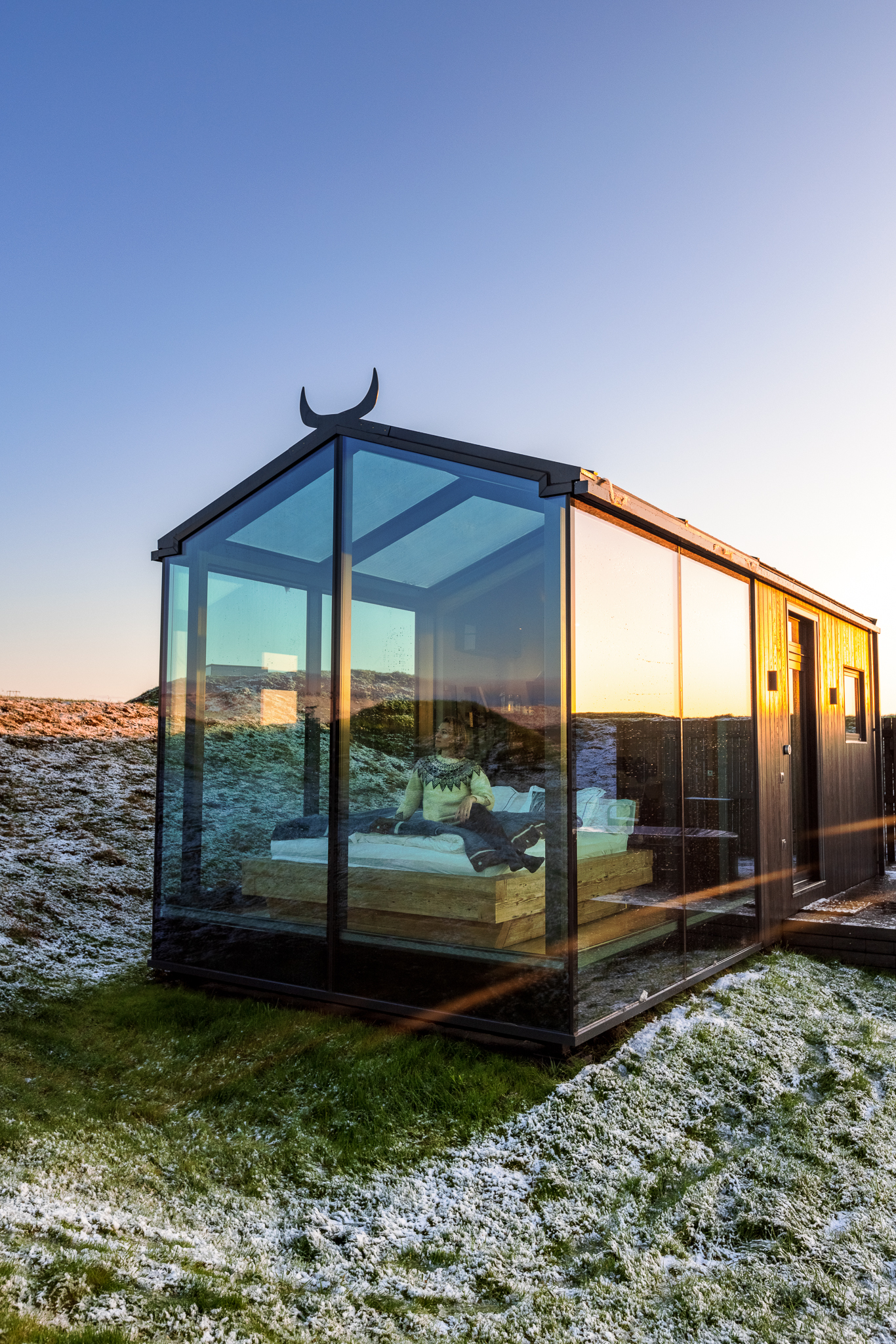 The outside of the Odin Panorama Glass Lodge in Iceland.